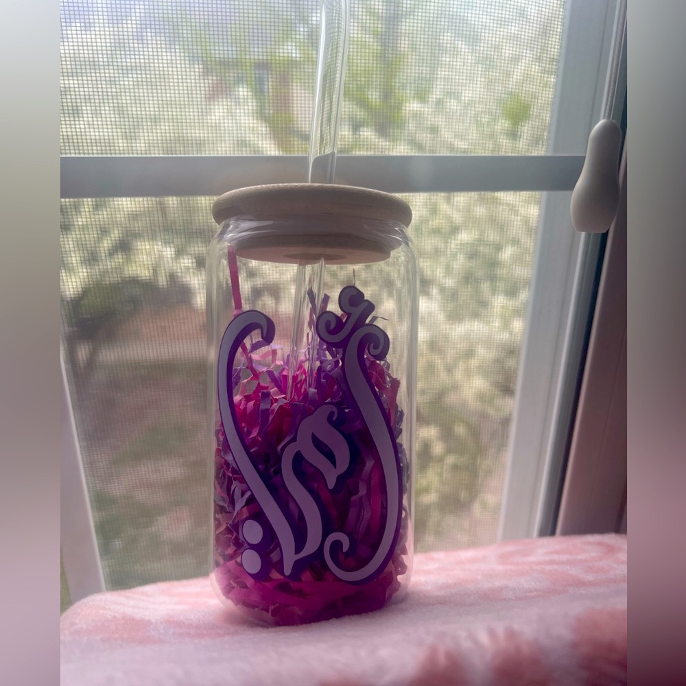 Glass cup with “mom” written in Arabic